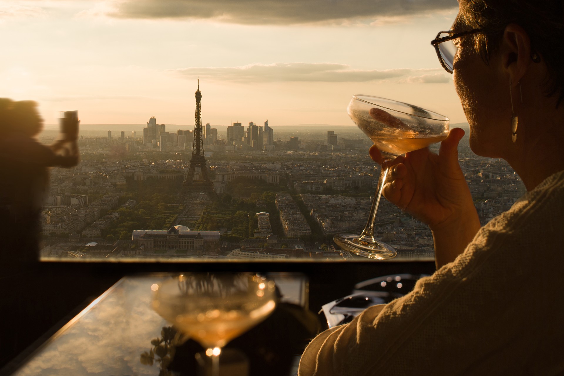 A woman drinks a cocktail